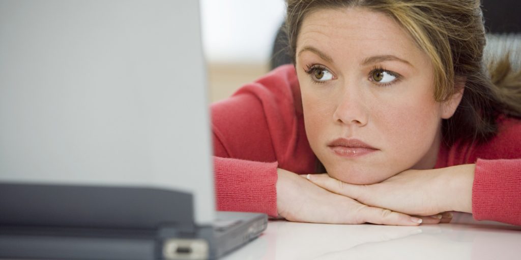 Woman sad at computer